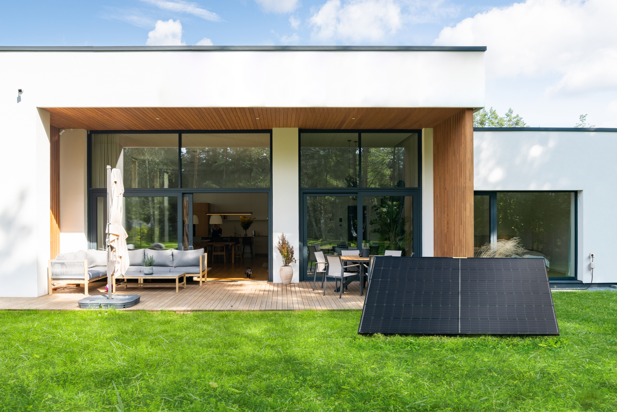 Backyard with green lawn of a modern private house.